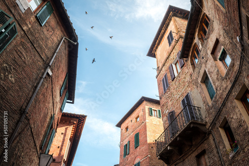 colorful street view of siena city, italy photo