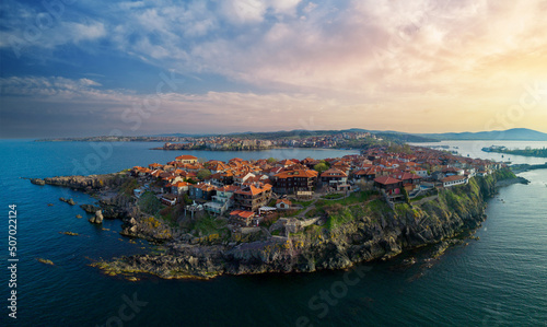 Fototapeta Naklejka Na Ścianę i Meble -  Panorama view from a height of the city of Nessebar with houses and parks washed by the Black Sea in Bulgaria