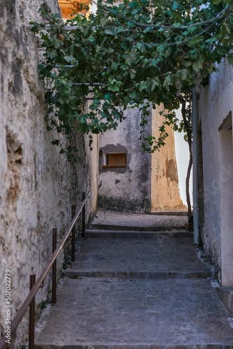 white old alleys between houses of an Andalusian village