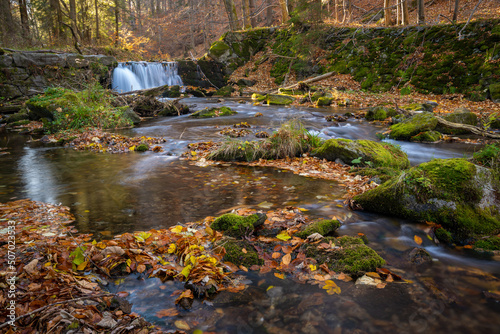 A small mountain waterfall and cascades on a mountain stream