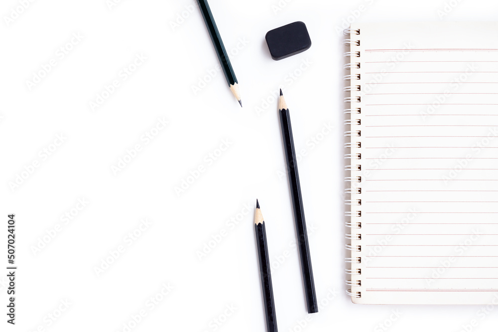 Notebook , Black pencils and black eraser isolated on white background Notebook , Black pencils and black eraser isolated on white background