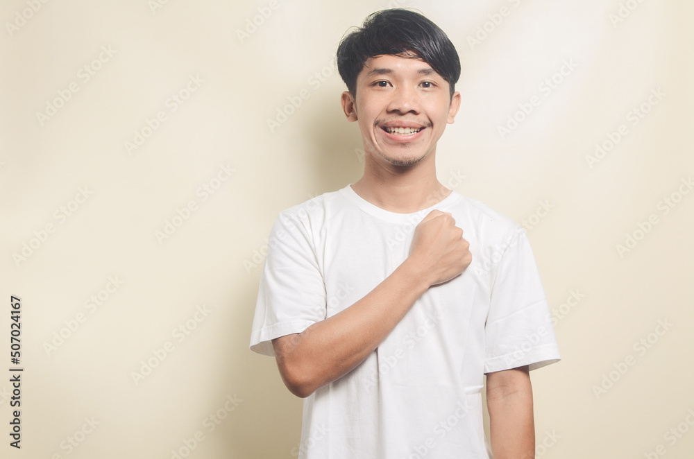 asian man resting hands on his chest asian man resting hands on his chest