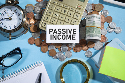 Passive Income on credit card with a coins and other objects.