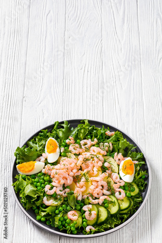 pink cocktail shrimps salad with veggies and eggs