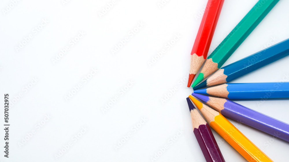 Colorful wooden pencils isolated on white background arranged in circle with copy space Colorful wooden pencils isolated on white background arranged in circle with copy space