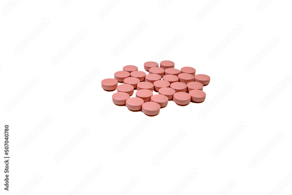 Selective focus of a handful of pills on white background. Pharmacist. Medicine Selective focus of a handful of pills on white background. Pharmacist. Medicine