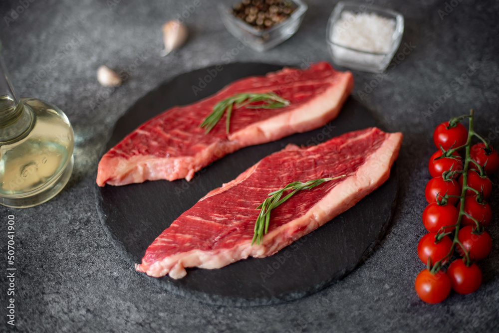 raw Picanha steak on stone background with spices raw Picanha steak on stone background with spices