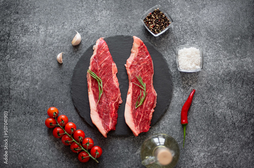 raw Picanha steak on stone background with spices