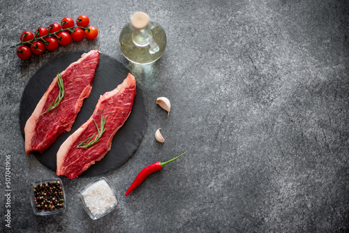 raw Picanha steak on stone background with spices with copy space for your text