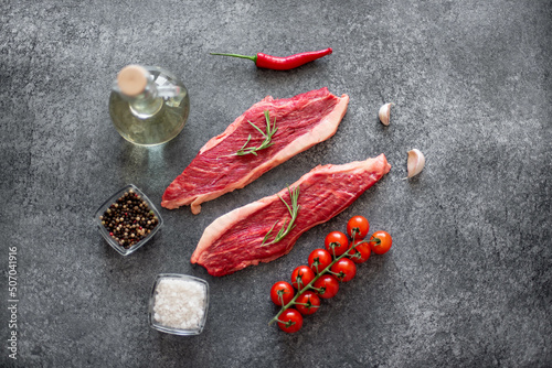 raw Picanha steak on stone background with spices photo