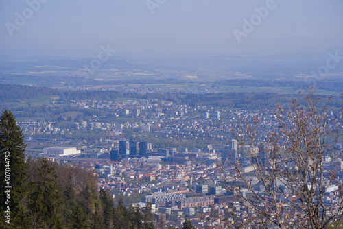 Aerial view over City of Zürich on a beautiful spring day with blue cloudy sky background. Photo taken April 21st, 2022, Zurich, Switzerland.