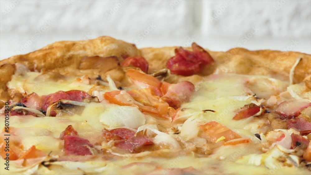 Pizza spinning on plate, back background. Close up shot of delicious pepperoni pizza with mozzarella being cooked in the oven. Tasty Italian pizza - food and drink 4k footage Pizza spinning on plate, back background. Close up shot of delicious pepperoni pizza with mozzarella being cooked in the oven. Tasty Italian pizza - food and drink 4k footage
