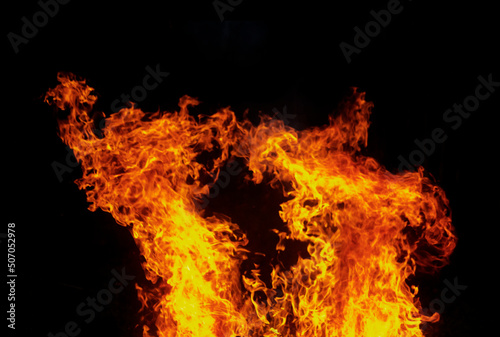 Flames isolated on black background for graphic design or wallpaper. © Nattawut