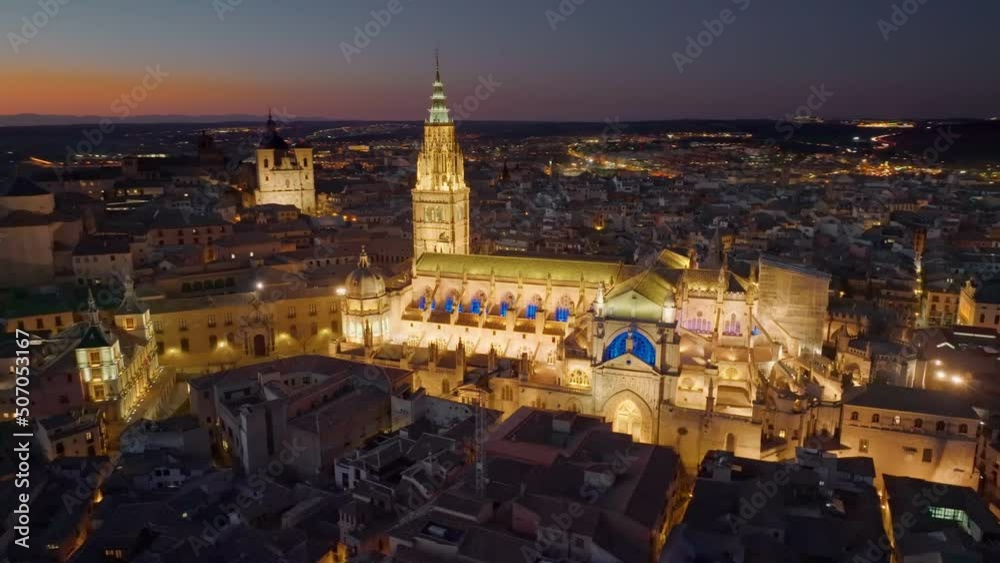 Flying over night Toledo, Spain at sunset. Aerial shot of street, houses and cathedrals in Toledo. 4K, UHD Flying over night Toledo, Spain at sunset. Aerial shot of street, houses and cathedrals in Toledo. 4K, UHD