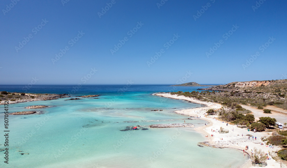 Beautiful coast with azure sea waters, drone view. Elafonisi Beach, Crete Beautiful coast with azure sea waters, drone view. Elafonisi Beach, Crete
