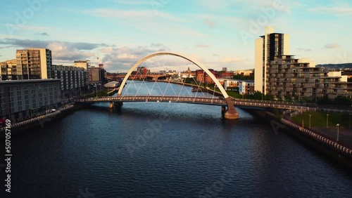 Aerial drone shot of Glasgow at sunset bridge over river clyde