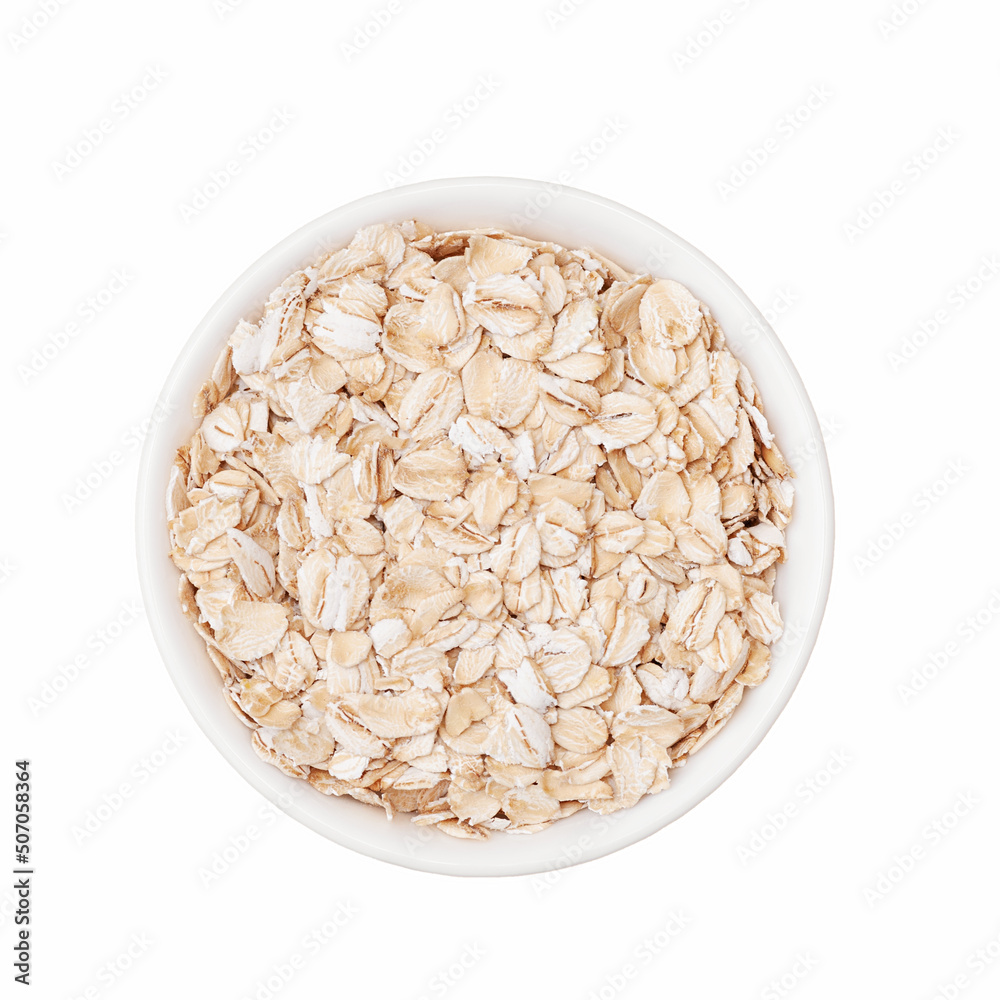 Oat flakes in white cup top view isolated on white background Oat flakes in white cup top view isolated on white background