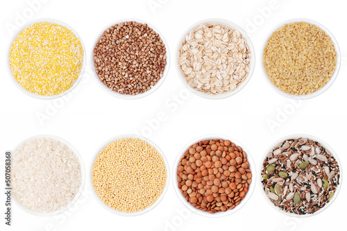 Set of different cereals: rice, buckwheat, corn, millet, bulgur, oatmeal in bowls on a white background