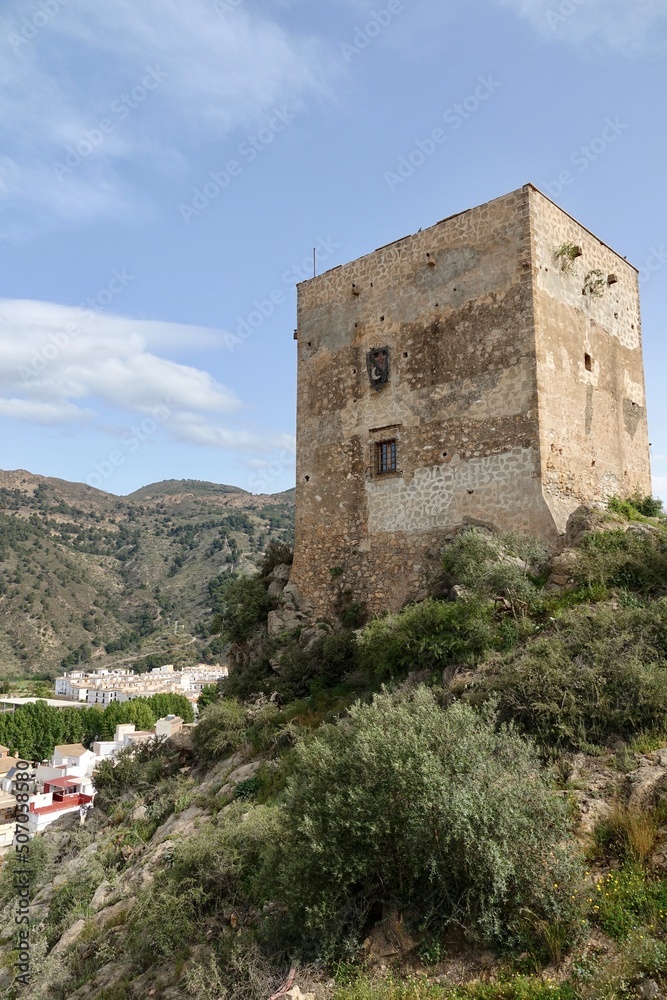 View of the Ulloa tower in the Granada town of Vélez de Benaudalla (Spain) on a sunny spring morning