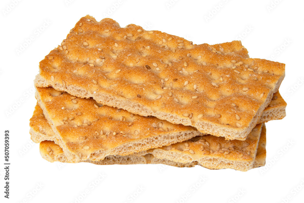 Many crispbread with sesame seeds isolated on the white background Many crispbread with sesame seeds isolated on the white background