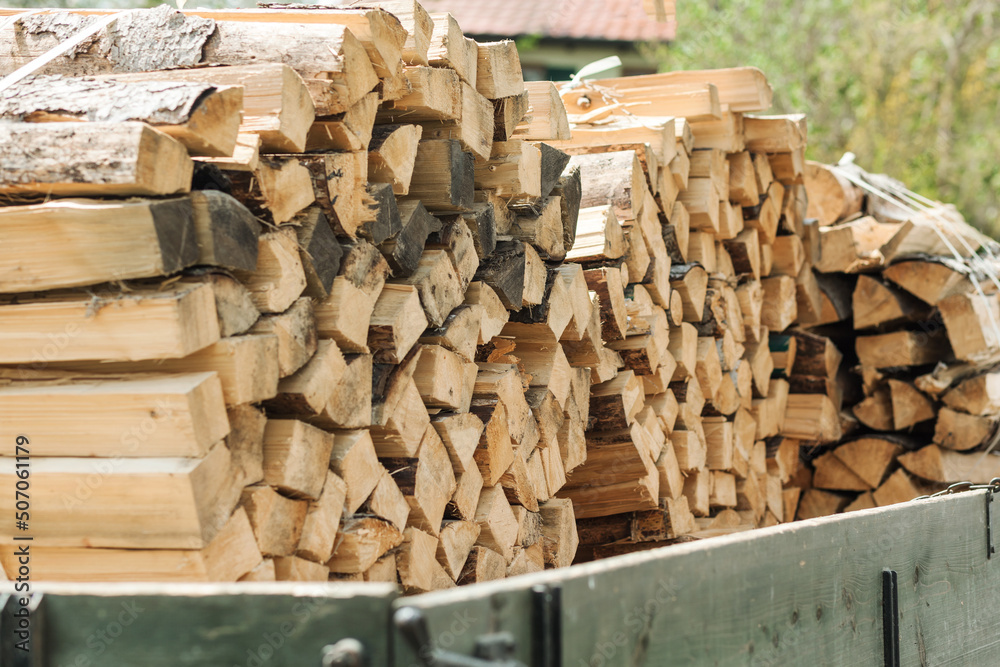 Firewood Stacks on car. Heap Firewood Delivery.Firewood for the winter. Firewood Stacks on car. Heap Firewood Delivery.Firewood for the winter.