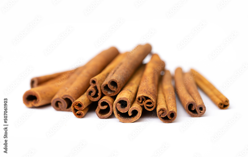 Cinnamon sticks on white background isolated. Indian spices close up. Medicinal herbs and spices. Cinnamon sticks on white background isolated. Indian spices close up. Medicinal herbs and spices.