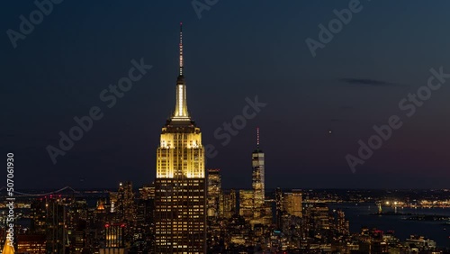 Night view of the skyline of New York, USA with the Empire State Building and One World Trade Center behind. 