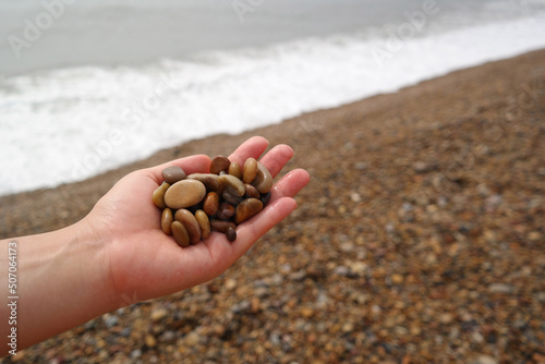 It is a stone that has been cut into a round pebble shape as the rock has been broken and eroded by waves and wind over a long period of time. To the touch, it is as smooth as silk.