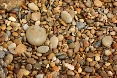 It is a stone that has been cut into a round pebble shape as the rock has been broken and eroded by waves and wind over a long period of time. To the touch, it is as smooth as silk.