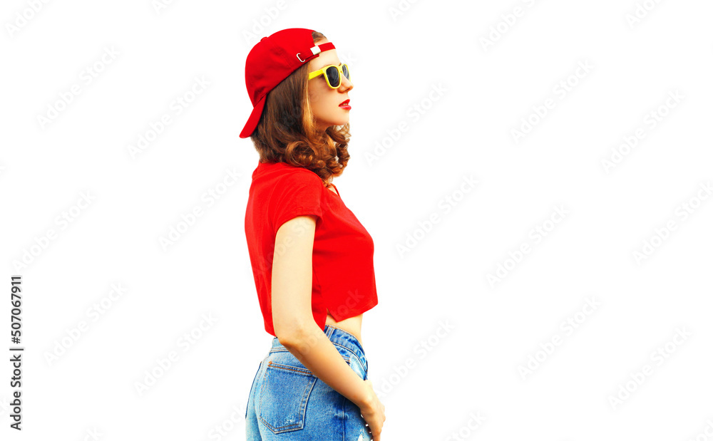 Portrait of stylish young woman wearing red baseball cap looking away isolated on white background, blank copy space for advertising text Portrait of stylish young woman wearing red baseball cap looking away isolated on white background, blank copy space for advertising text