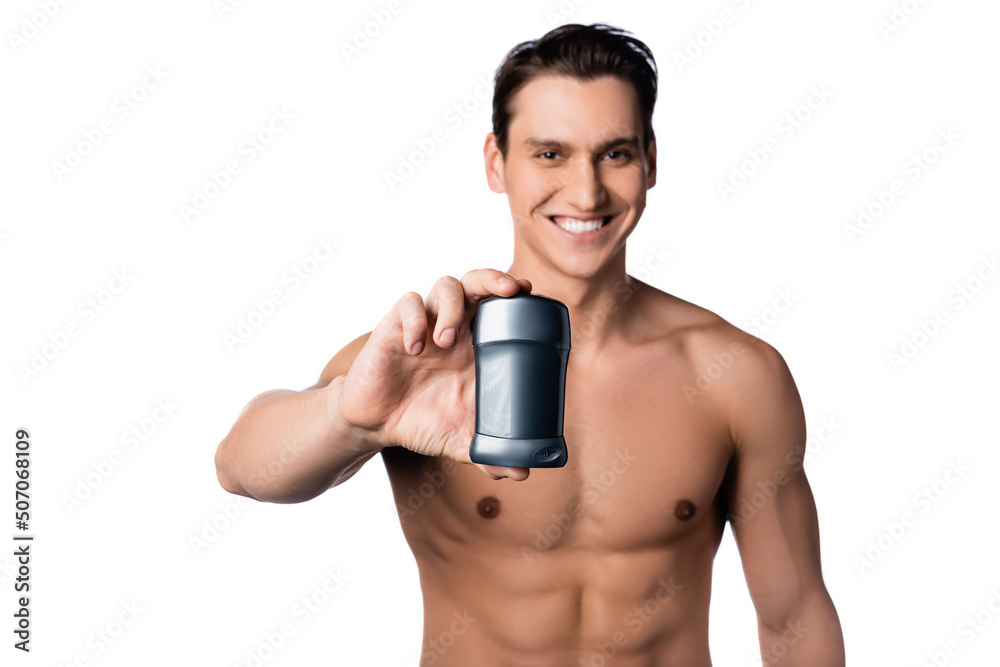 smiling shirtless man holding dry deodorant isolated on white. smiling shirtless man holding dry deodorant isolated on white.