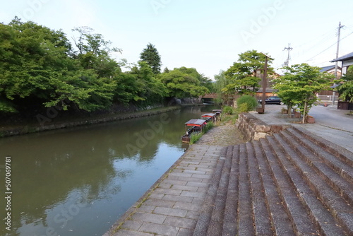 A scene of excursion boats and Hachiman-bori Moat in a riverside district of Omihachiman City in Shiga Prefecture in Japan 日本の滋賀県の近江八幡市の水郷地帯の八幡堀と観光ボートの風景