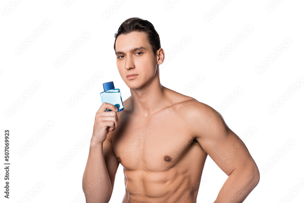 Fototapeta premium shirtless muscular man with vial of perfume looking at camera isolated on white.