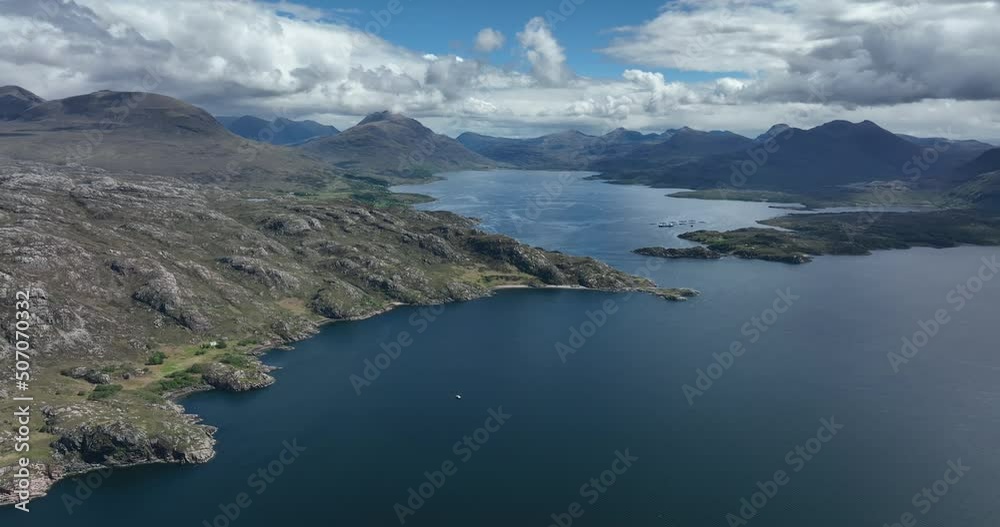 Aerial view of the landscape surrounding Diabaig, Lower Diabaig and Torridon village in the north west highlands of Scotland during summer on a blue sky day with light clouds Aerial view of the landscape surrounding Diabaig, Lower Diabaig and Torridon village in the north west highlands of Scotland during summer on a blue sky day with light clouds