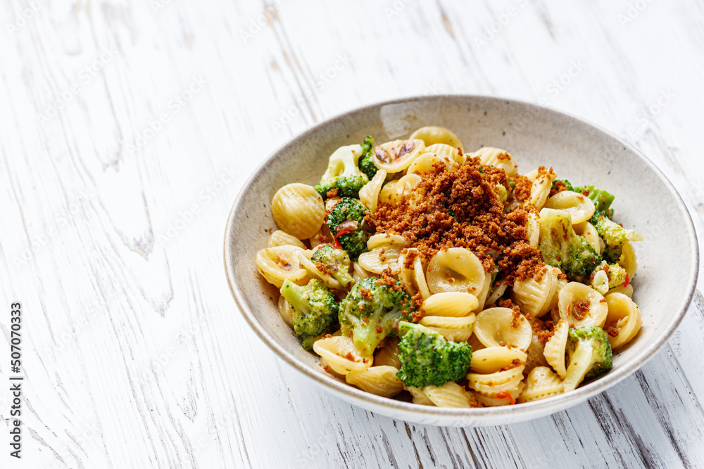 orequette pasta with broccoli on a white background orequette pasta with broccoli on a white background