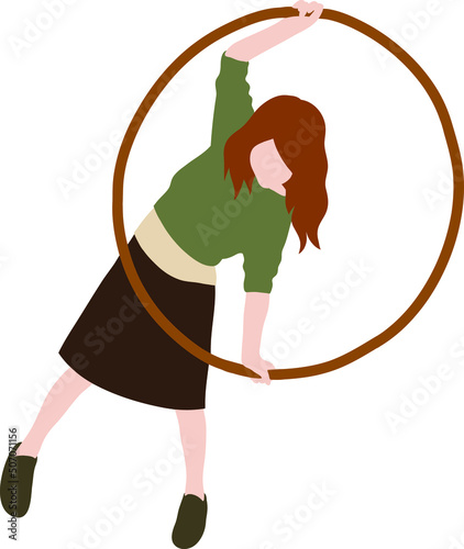 A girl in a skirt and a green sweater holds a large gymnastic hoop in her hands.
