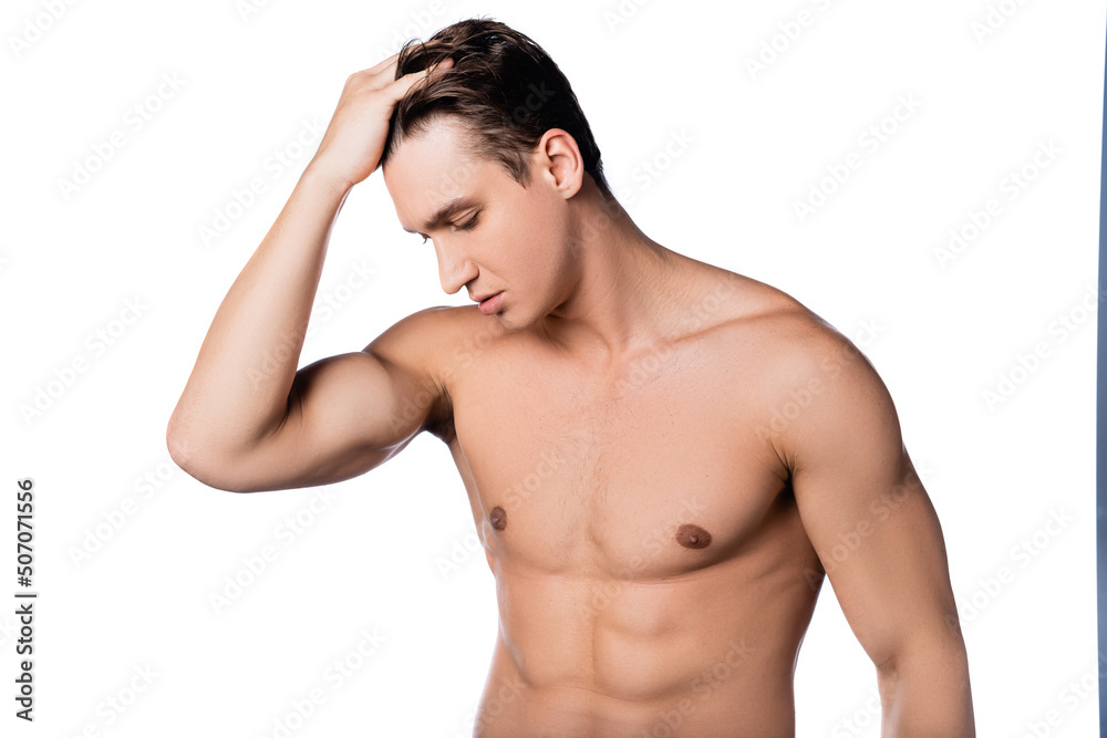 shirtless man with muscular torso touching hair isolated on white.