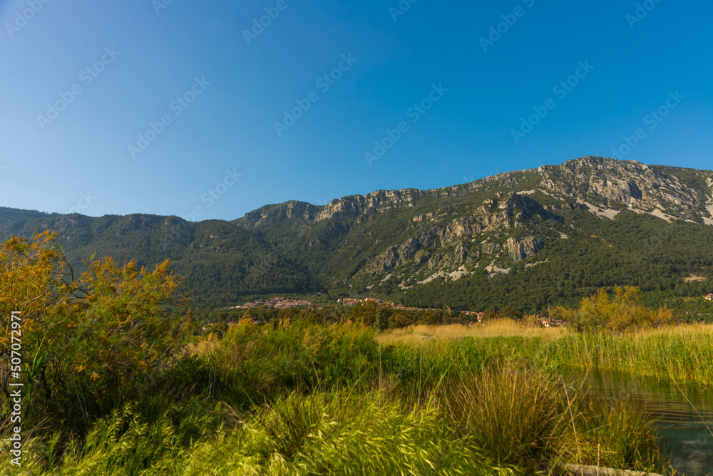 AKYAKA, MUGLA, TURKEY: Landscape with a view of the mountains and the village of Akyaka on a sunny day