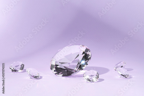 Lilac background for product presentation with diamonds. Minimal concept and hard sunlight.