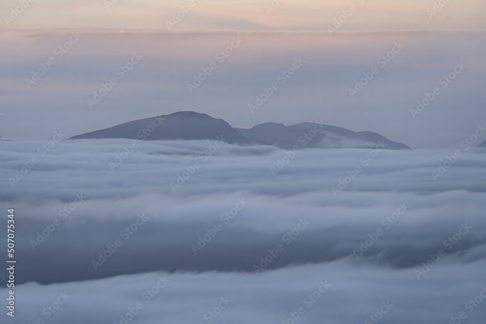 Snowdonia mountains above a spectacular cloud inversion in Wales UK