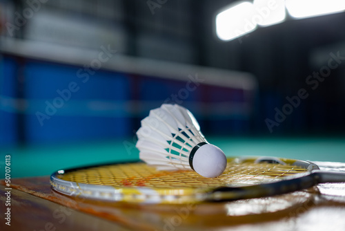 Badminton shuttlecock and racket with blur player background  © waranyu