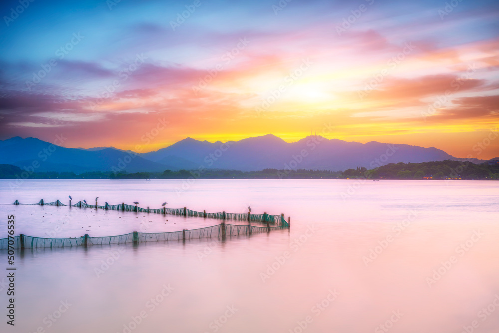 The beautiful of silhouette sunset landscape scenery of Xihu West Lake and pavilion in Hangzhou CHINA.