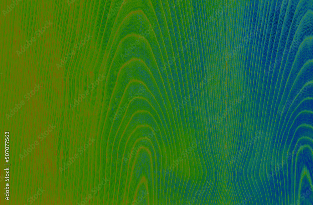 Obraz premium Abstract wood pattern in green, blue and orange tones. Artistic image processing created from wood veneer surface photo. Beautiful wooden texture background for any design.