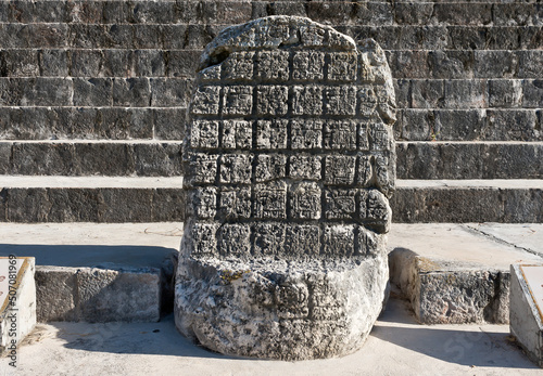 Stone throne at the Nun's Quadrangle building complex at the ruins of the ancient Mayan city Uxmal, Mexico. photo