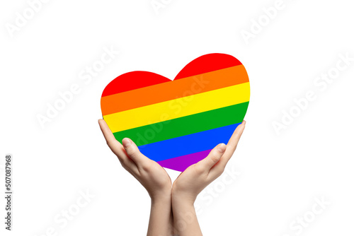 Rainbow colored cardboard heart in woman s hands  LGBTQ  love concept.