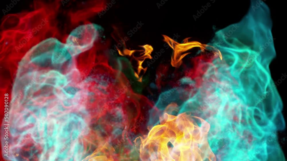 Super slow motion of multi colored fire blasts isolated on black background. Filmed on high speed cinema camera, 1000 fps.
