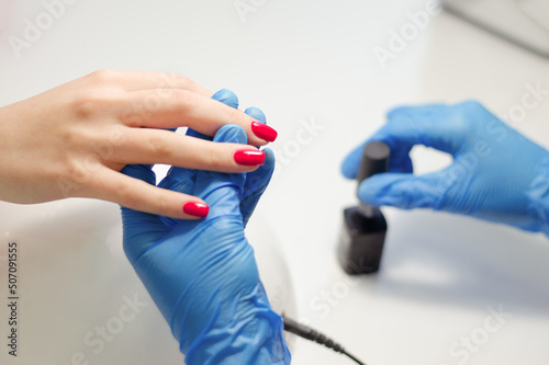 Wallpaper Mural The master makes a manicure to a client in a nail salon Torontodigital.ca