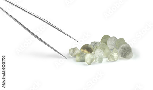 Photos Rough Diamond Crystals with Gemmology Tongs Isolated on White Background
