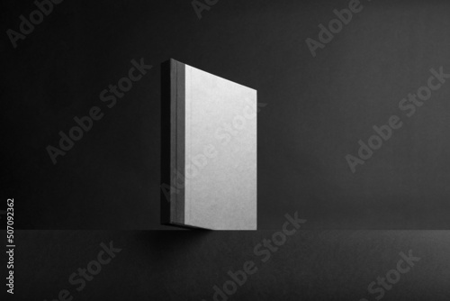 Black branding notebook  brochure mockup template  real photo. Blank isolated on a black background to place your design