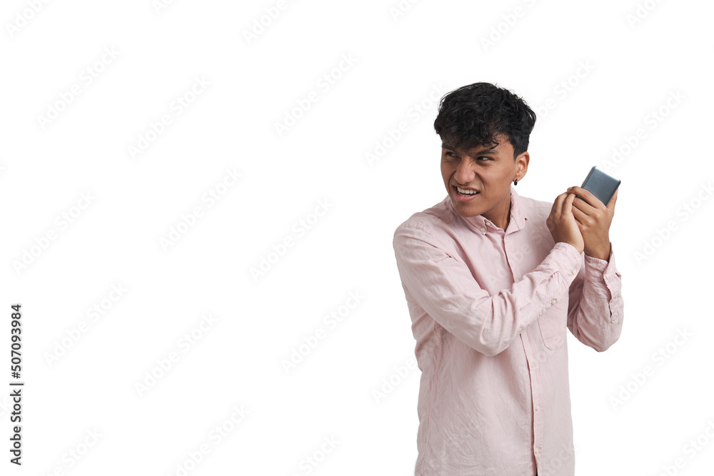 Young peruvian man covering telephone receiver to privately talk with someone. Isolated over white background. Young peruvian man covering telephone receiver to privately talk with someone. Isolated over white background.